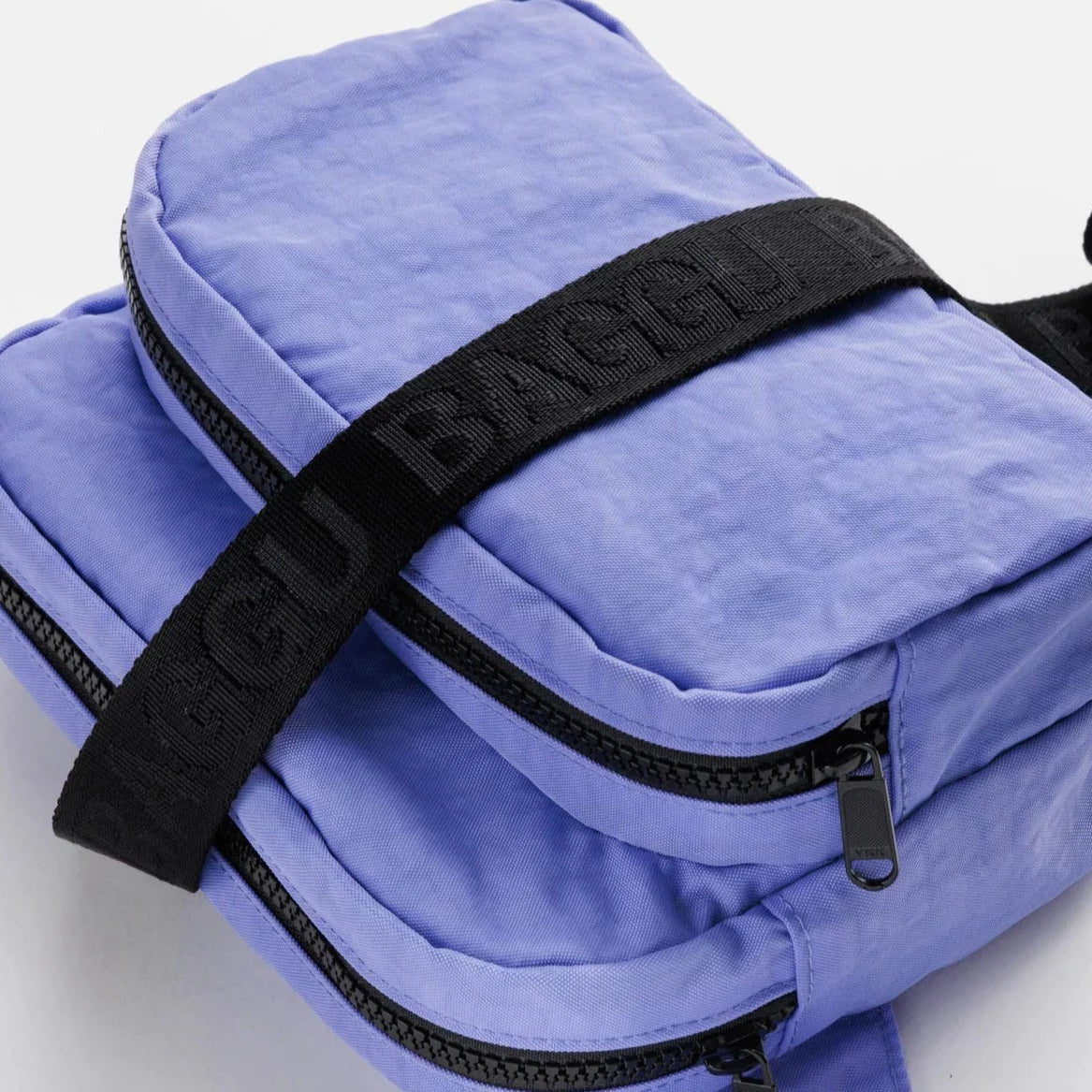 Blue Fanny Pack with Black Zippers and Black Strap with De-bossed Strap with "BAGGU" Text