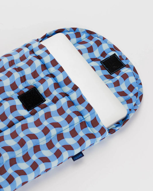 Puffy Quilted Laptop Sleeve with Wavy Gingham Blue, white, and red brown Pattern holding laptop with velcro closure