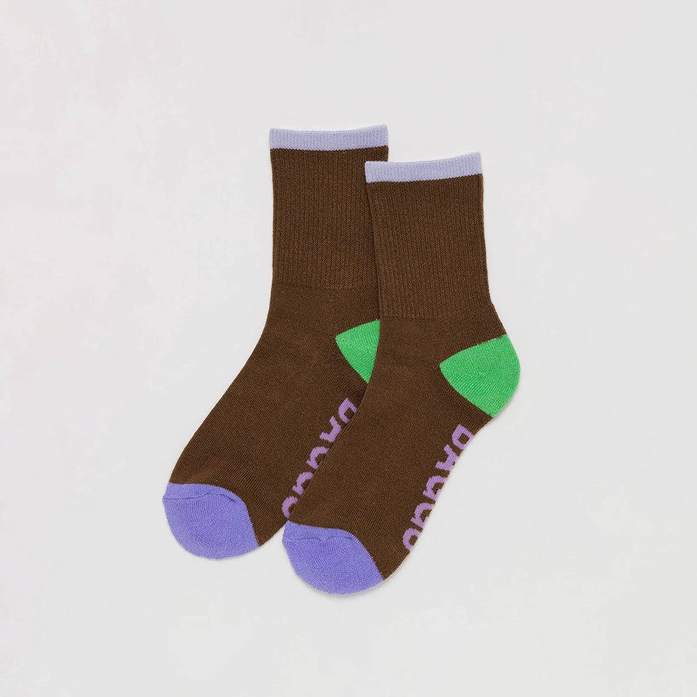 Brown Socks with Lilac Ankle Stripe, Green heel, Radiant Purple colour blocked toes, dusty pink "BAGGU" text on bottom of feet
