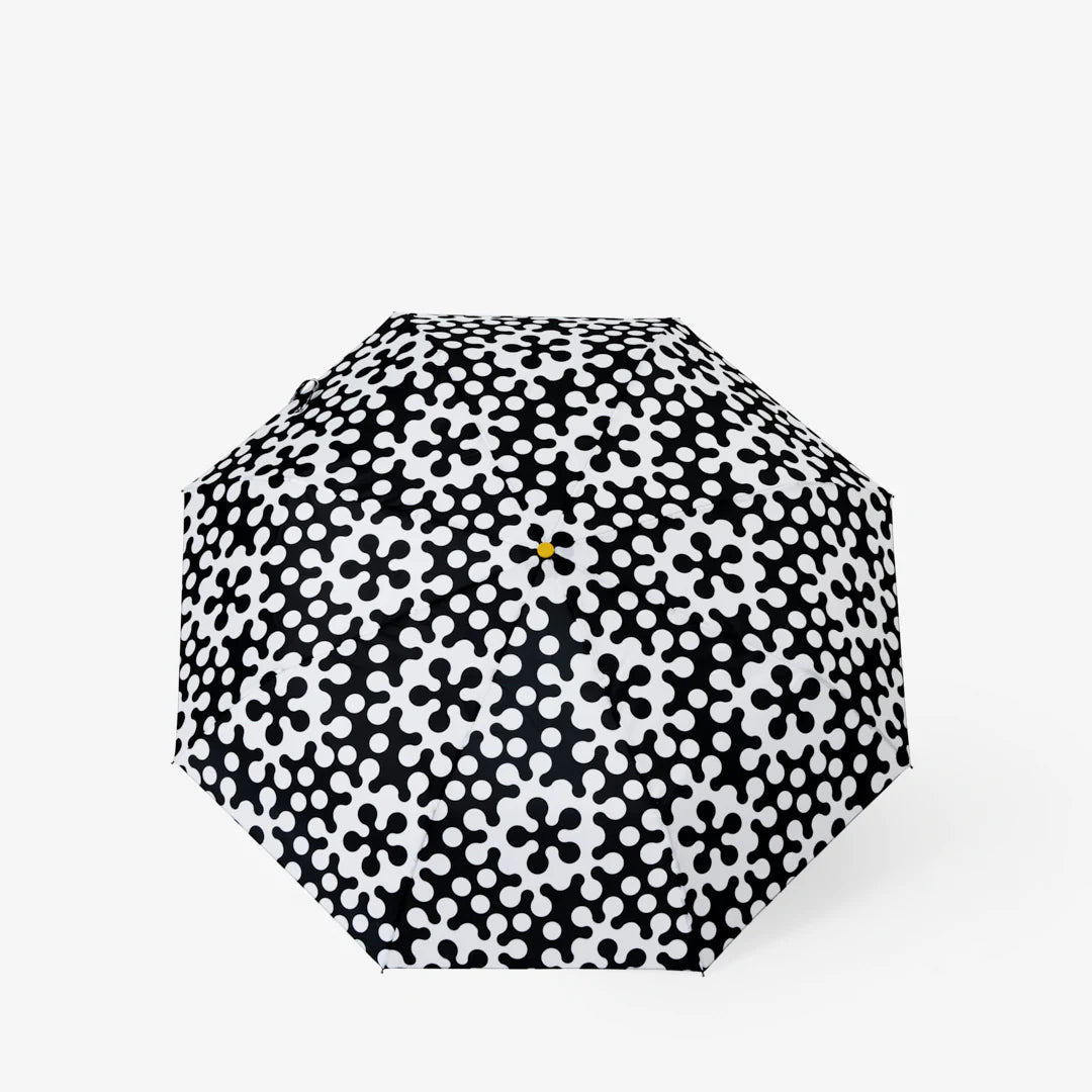 Dusen Dusen Atom Umbrella with bold black and white graphic pattern pop of yellow on top and blue handle